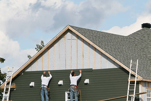 Professional Siding technician working in Woolford, MD